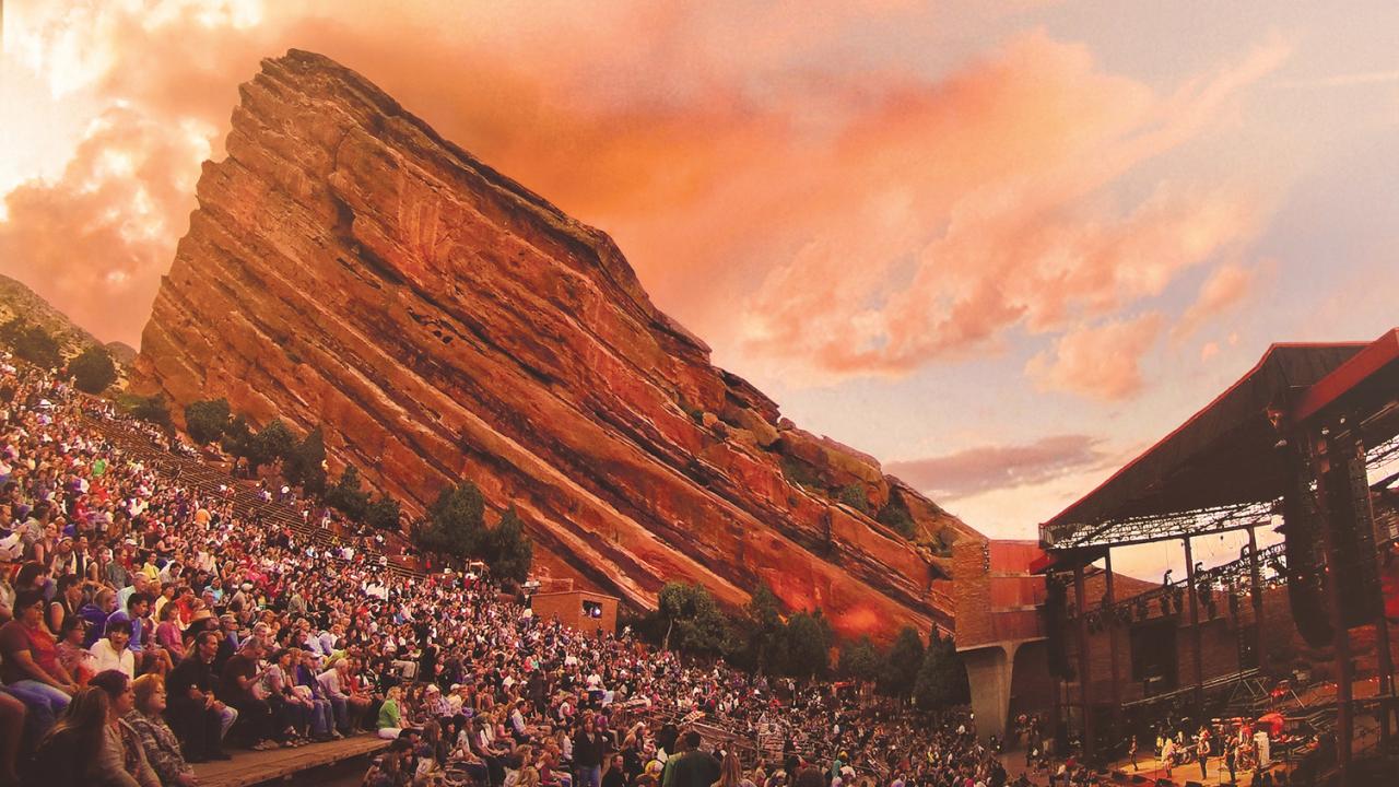 Watching a concert at Red Rocks Amphitheatre in Denver, Colorado Watching a concert at Red Rocks Amphitheatre in Denver, Colorado