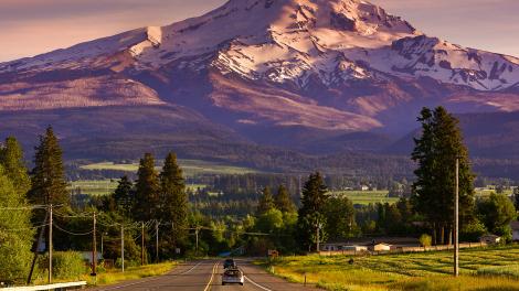Scenic drive in front of a snow-covered mountain Scenic drive in front of a snow-covered mountain
