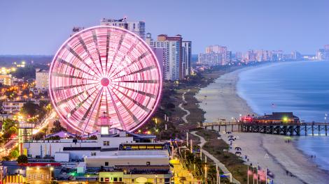 The neon-lit SkyWheel, a beacon on Ocean Boulevard The neon-lit SkyWheel, a beacon on Ocean Boulevard