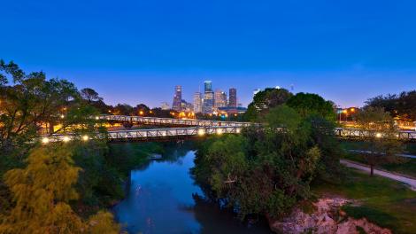 The Houston, Texas, skyline at night from a lush park The Houston, Texas, skyline at night from a lush park
