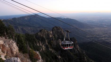 View of the Sandia Tram as it climbs up the steep mountainside View of the Sandia Tram as it climbs up the steep mountainside