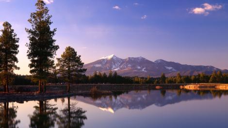 View of the mountains beyond a stunning lake View of the mountains beyond a stunning lake