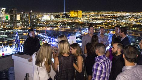 Socializing at a rooftop bar overlooking Las Vegas, Nevada Socializing at a rooftop bar overlooking Las Vegas, Nevada