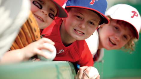 Young Philadelphia Phillies Fans Cheer during Spring Training. Young Philadelphia Phillies Fans Cheer during Spring Training.