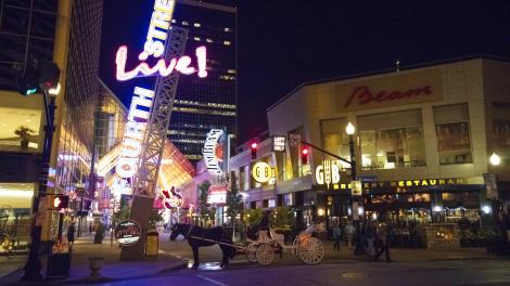 Horse-drawn carriage tours and lively nightlife in downtown Louisville, Kentucky Horse-drawn carriage tours and lively nightlife in downtown Louisville, Kentucky
