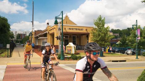 Cycling along the Razorback Regional Greenway through the heart of the city Cycling along the Razorback Regional Greenway through the heart of the city