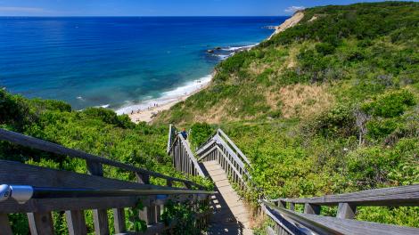 Sandy beach at the base of Mohegan Bluffs on the southern shore of Block Island Sandy beach at the base of Mohegan Bluffs on the southern shore of Block Island