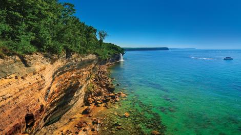 Signature sandstone cliffs hugging the shore of Lake Superior Signature sandstone cliffs hugging the shore of Lake Superior