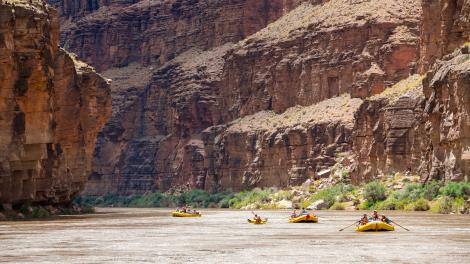 Rafting the Colorado River through the vast cliffs of the Grand Canyon Rafting the Colorado River through the vast cliffs of the Grand Canyon