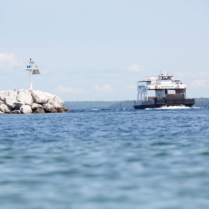 A ship passing through Death’s Door strait in Wisconsin A ship passing through Death’s Door strait in Wisconsin