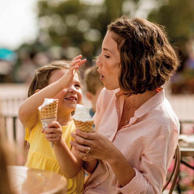 Mother-and-daughter share a moment over ice cream in Orlando, Florida Mother-and-daughter share a moment over ice cream in Orlando, Florida
