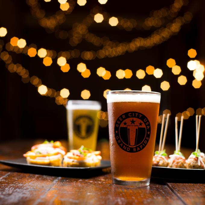 Two pints of craft beer paired with appetizers in Grand Rapids, Michigan Two pints of craft beer paired with appetizers in Grand Rapids, Michigan