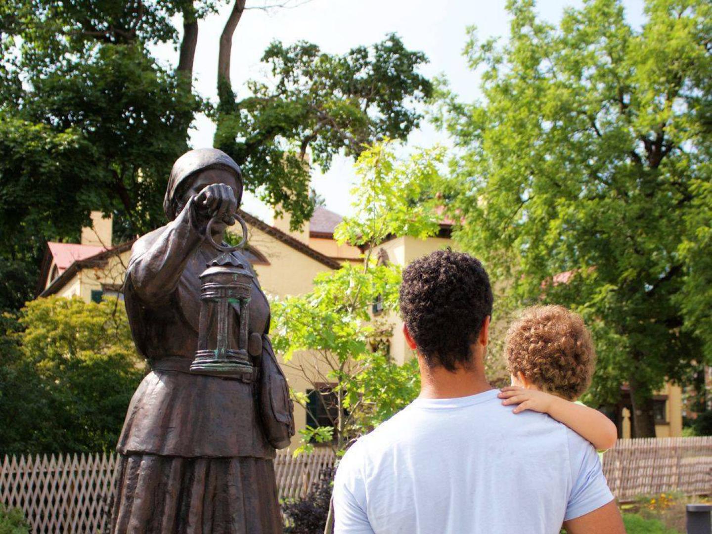 Admiring a statue of Harriet Tubman at the Harriet Tubman Home in Auburn, New York Admiring a statue of Harriet Tubman at the Harriet Tubman Home in Auburn, New York
