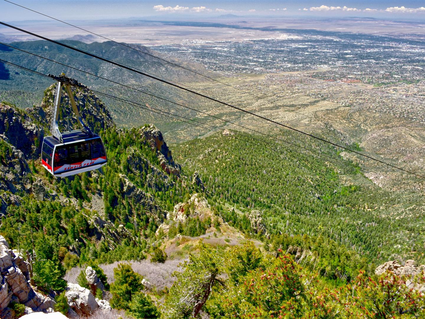 The Sandia Peak Aerial Tramway rises above Albuquerque, New Mexico The Sandia Peak Aerial Tramway rises above Albuquerque, New Mexico
