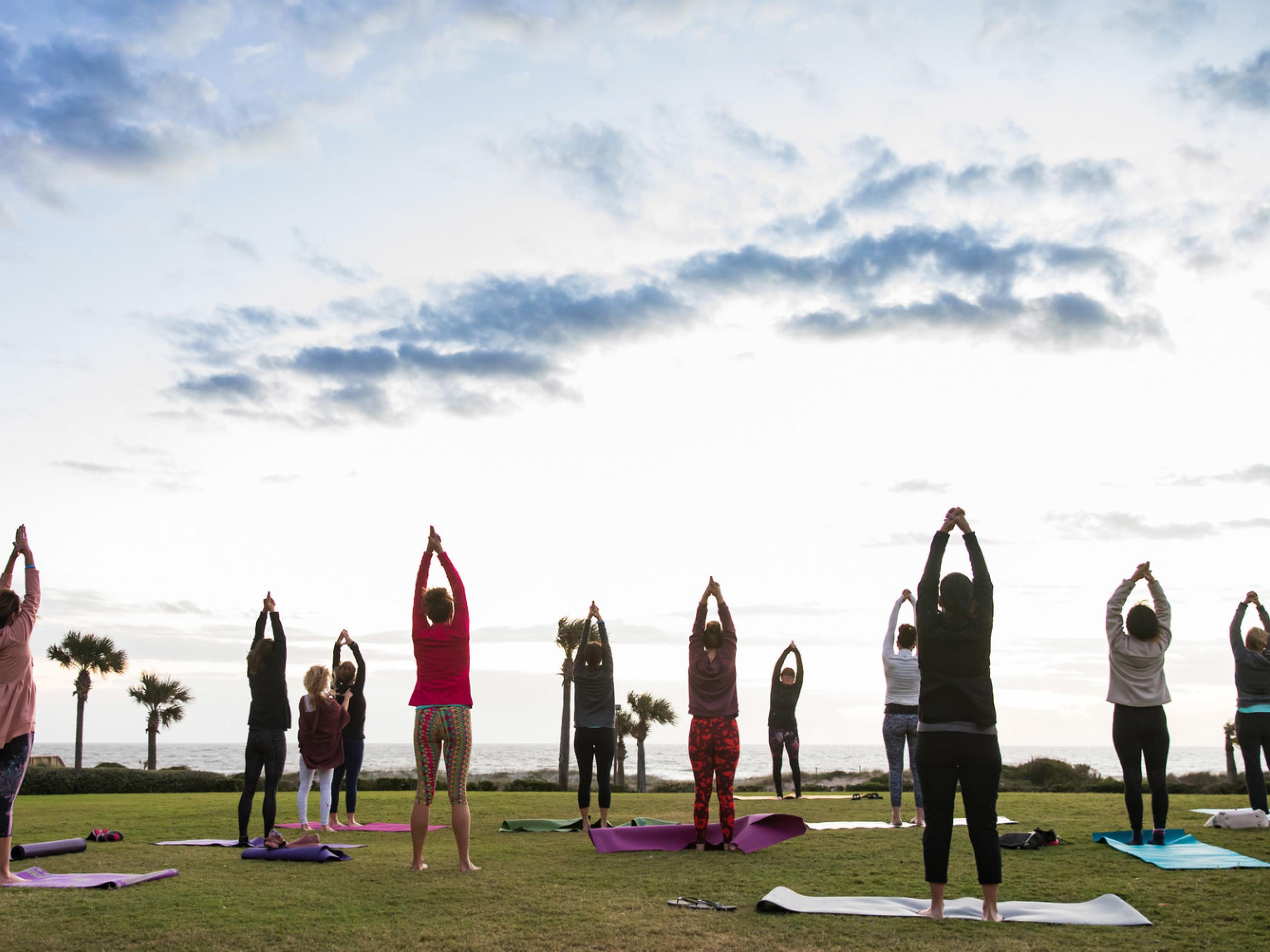 Beachfront yoga during the Amelia Island Wellness Festival Beachfront yoga during the Amelia Island Wellness Festival