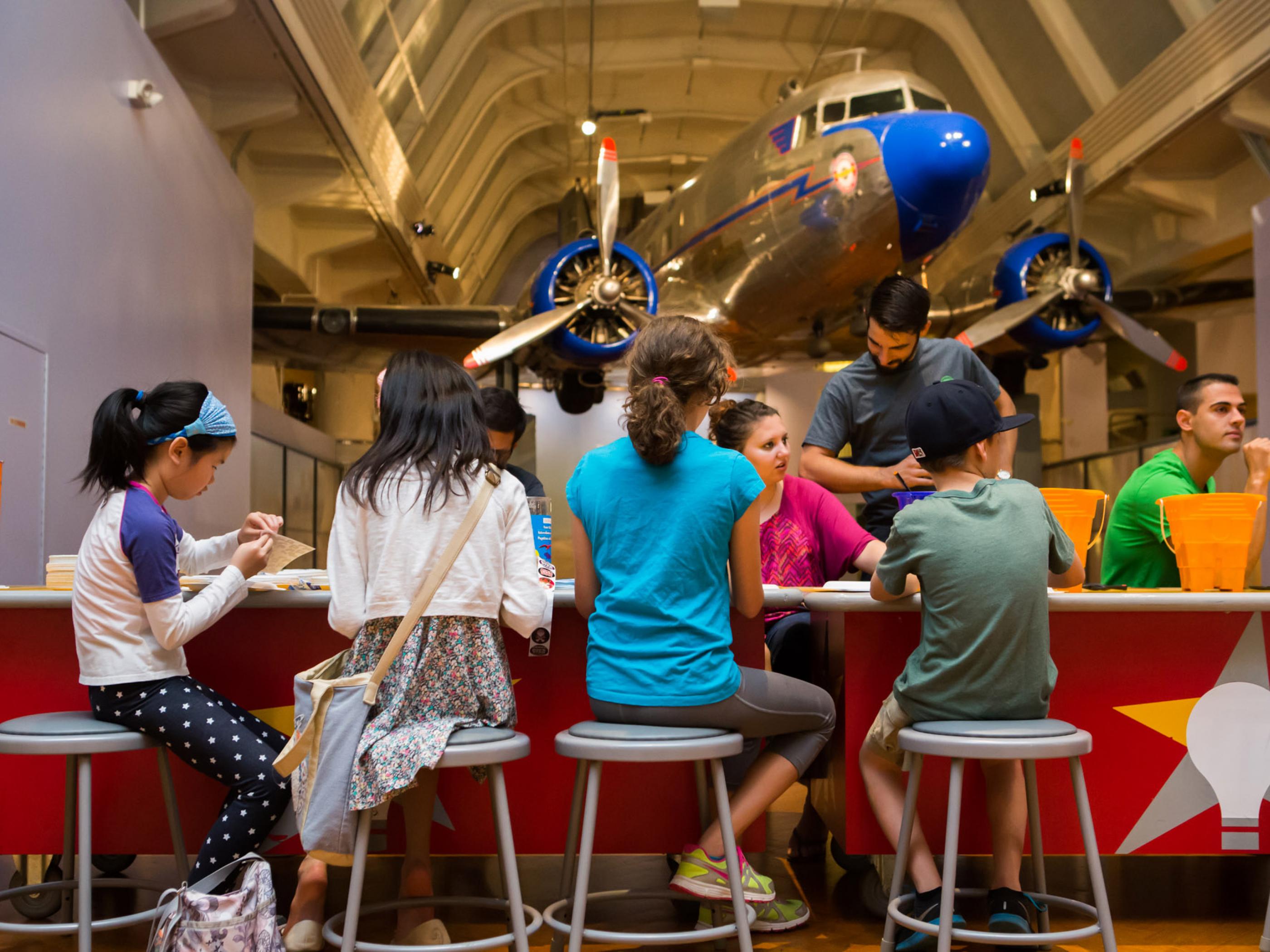 Children tinkering to create projects at The Henry Ford’s Maker Faire Children tinkering to create projects at The Henry Ford’s Maker Faire