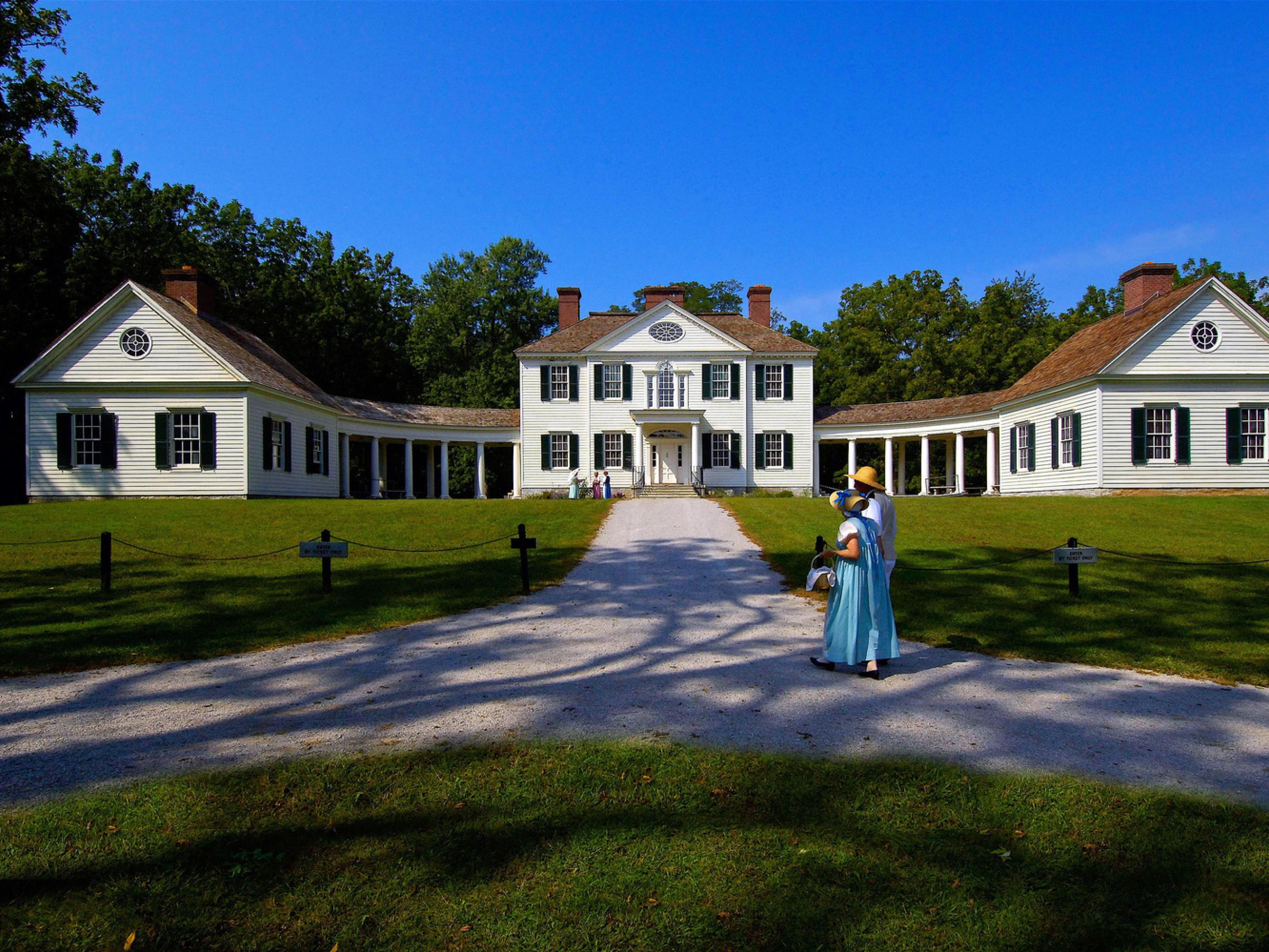 Costumed reenactors walk Blennerhassett Island Historical State Park’s grounds. Costumed reenactors walk Blennerhassett Island Historical State Park’s grounds.