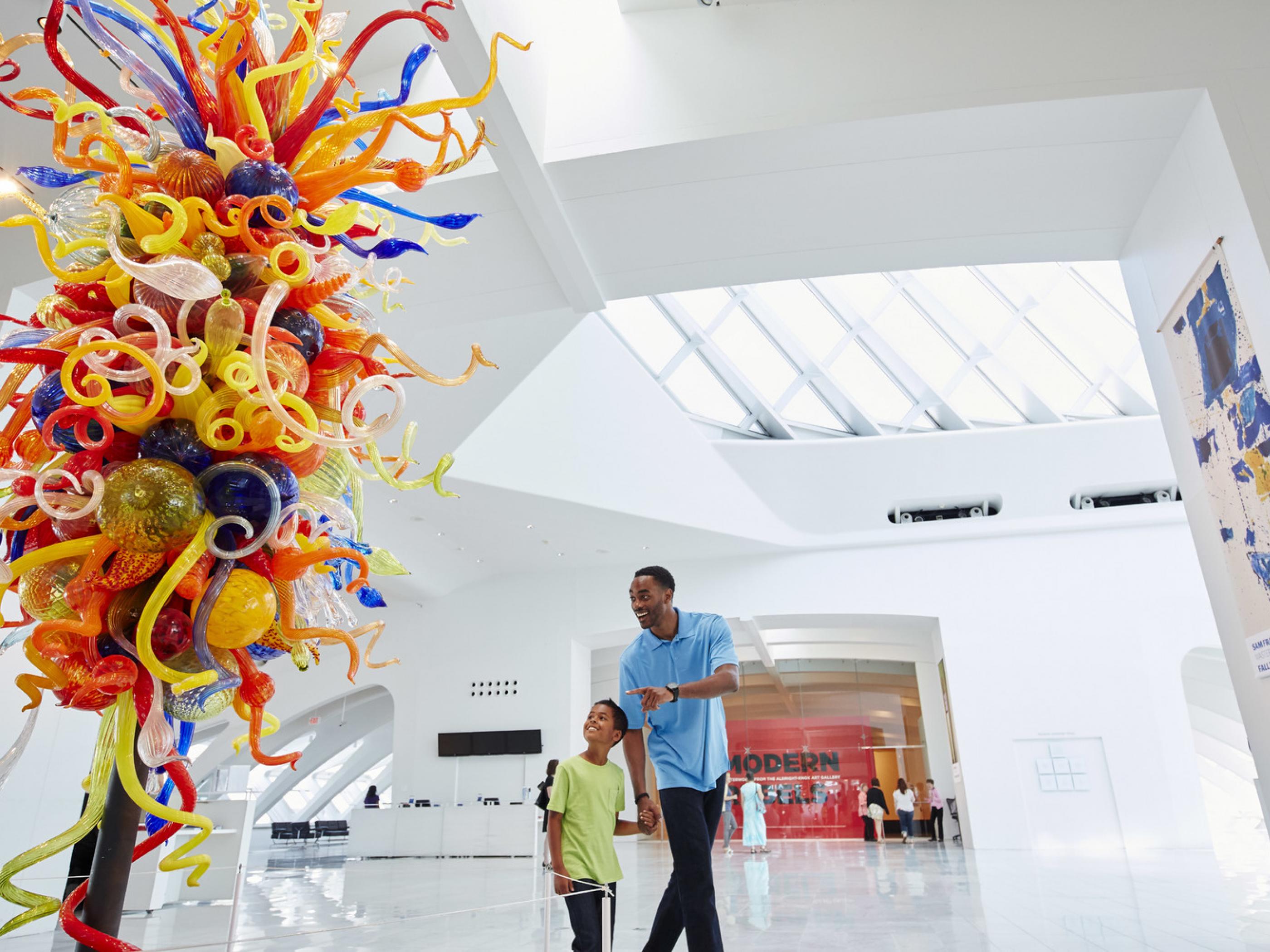 Father and son check out a glass sculpture in the Milwaukee Art Museum Father and son check out a glass sculpture in the Milwaukee Art Museum