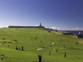 Flying kites on a sunny day at the El Morro Fort Flying kites on a sunny day at the El Morro Fort