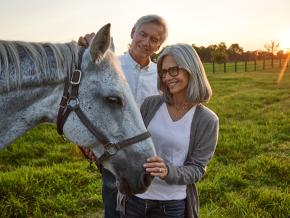 A couple interacts with a horse at Spycoast Farm in Lexington, Kentucky A couple interacts with a horse at Spycoast Farm in Lexington, Kentucky