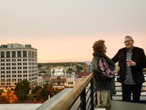 Enjoying drinks and city views at sunset at Vantage Rooftop Lounge and Conservatory Enjoying drinks and city views at sunset at Vantage Rooftop Lounge and Conservatory