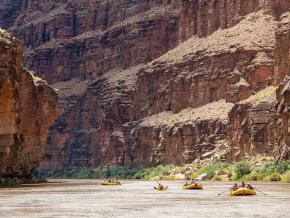 Rafting the Colorado River through the vast cliffs of the Grand Canyon near Grand Canyon Village, Arizona Rafting the Colorado River through the vast cliffs of the Grand Canyon near Grand Canyon Village, Arizona