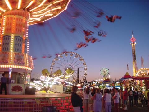 People enjoying thrill rides at the Minnesota State Fair People enjoying thrill rides at the Minnesota State Fair