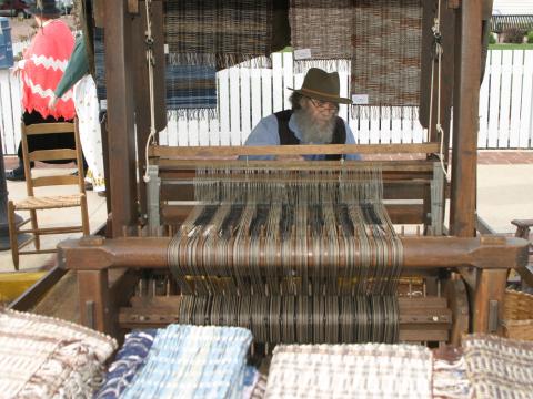 Working the loom at the Folklife Festival Working the loom at the Folklife Festival