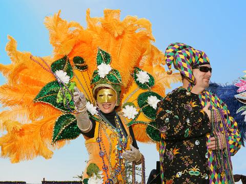 Throwing beads to the crowd during Lake Charles Mardi Gras Throwing beads to the crowd during Lake Charles Mardi Gras