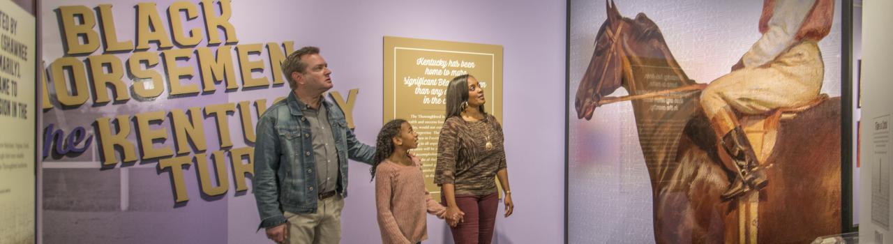 A family enjoys historical exhibits at the International Museum of the Horse in Lexington, Kentucky A family enjoys historical exhibits at the International Museum of the Horse in Lexington, Kentucky