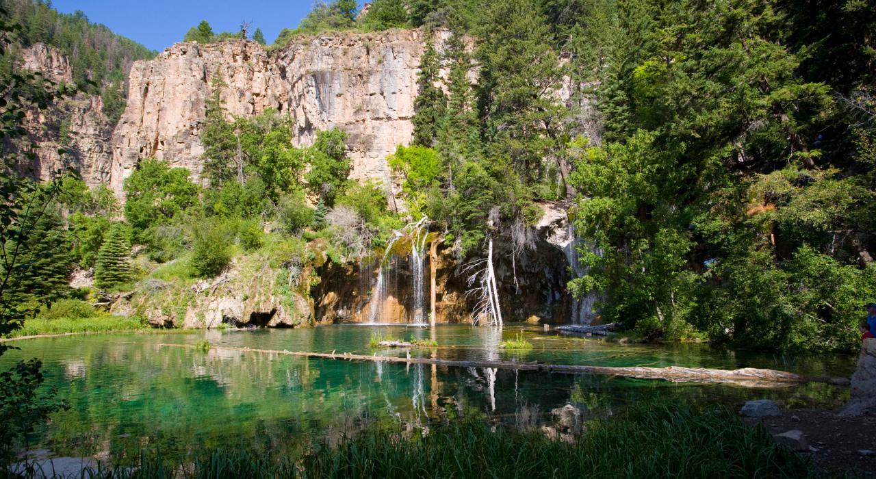 Waterfalls cascading over cliffs at Hanging Lake, a National Natural Landmark Waterfalls cascading over cliffs at Hanging Lake, a National Natural Landmark