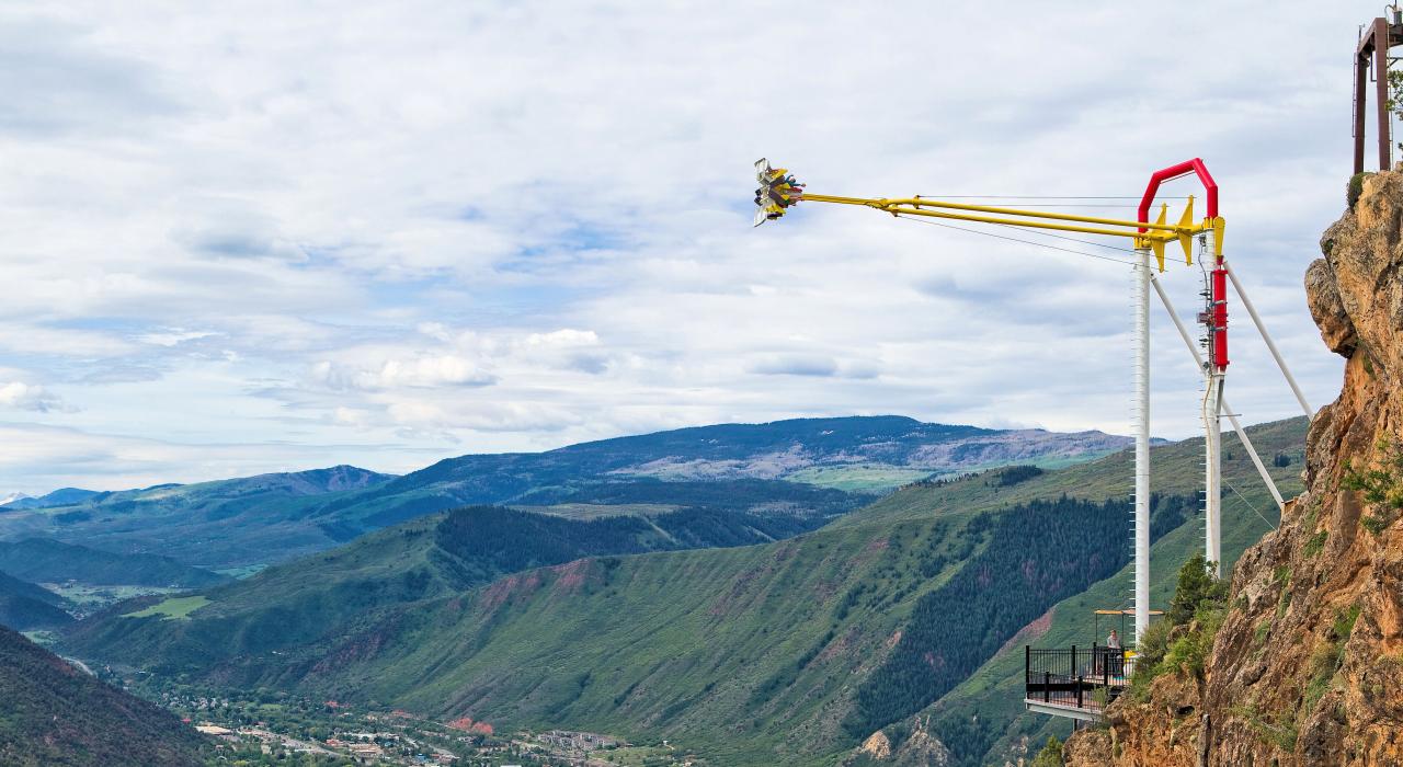 The Giant Canyon Swing at Glenwood Caverns Adventure Park towering high above the city The Giant Canyon Swing at Glenwood Caverns Adventure Park towering high above the city