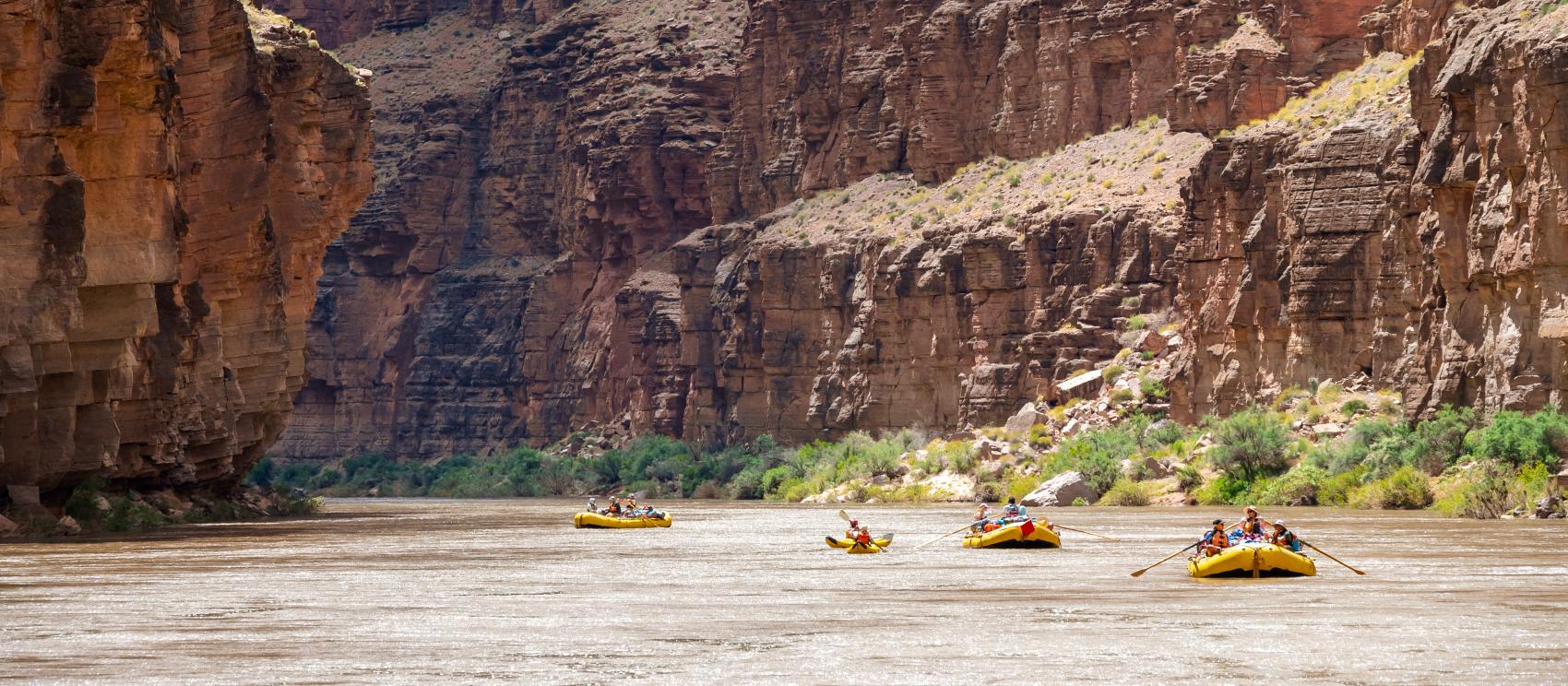 Rafting the Colorado River through the vast cliffs of the Grand Canyon Rafting the Colorado River through the vast cliffs of the Grand Canyon